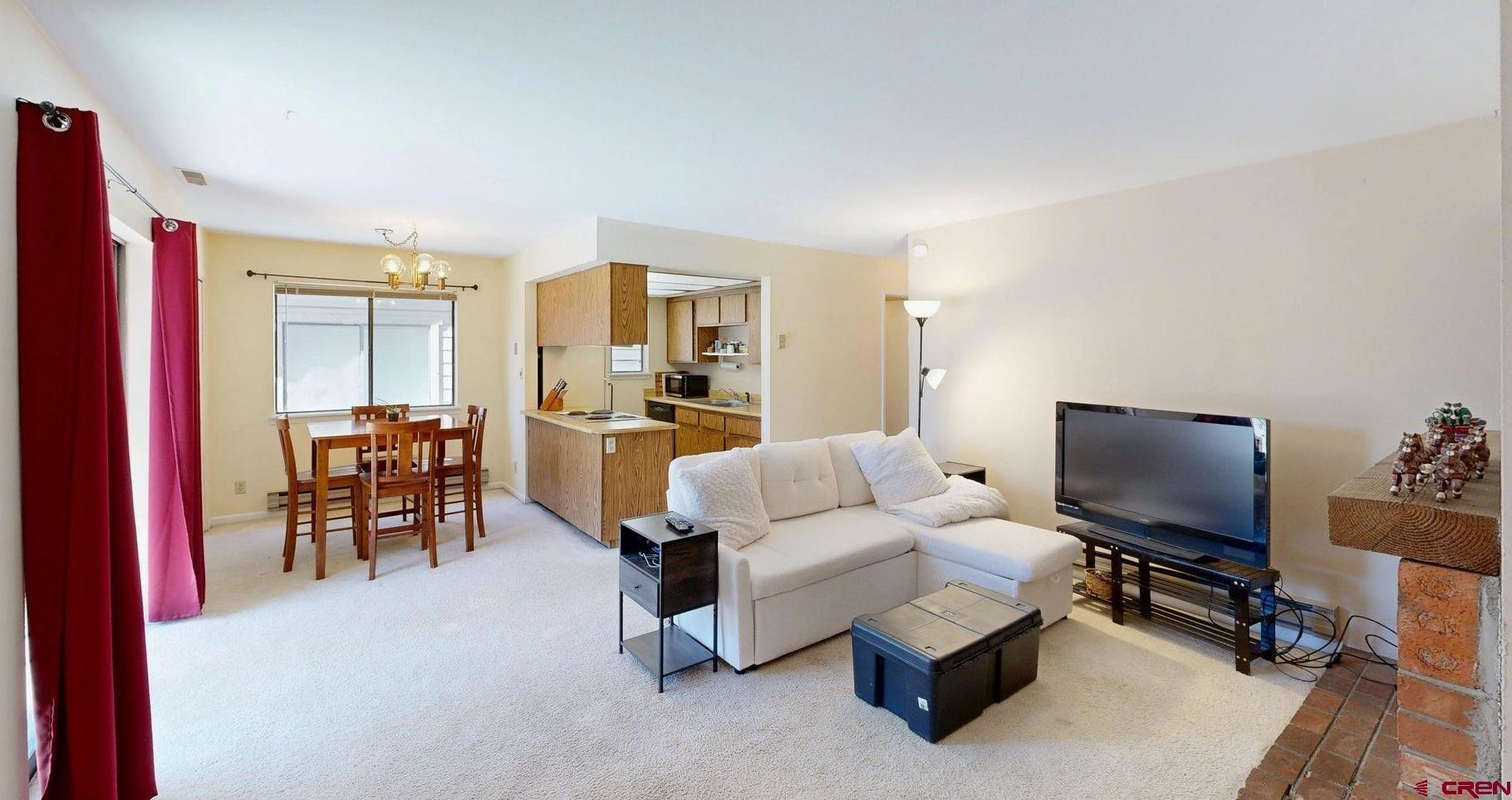 1200 Florida Road, Unit 52 Durango, CO 81301 - Photo 3 of 29 a living room with furniture and a flat screen tv