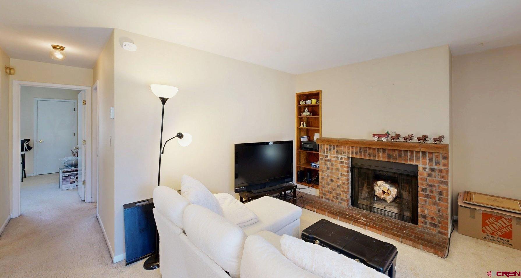 1200 Florida Road, Unit 52 Durango, CO 81301 - Photo 4 of 29 a living room with furniture and a fireplace