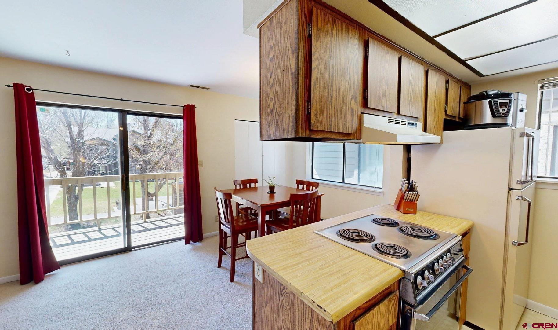 1200 Florida Road, Unit 52 Durango, CO 81301 - Photo 5 of 29 a dining room with furniture and a floor to ceiling window