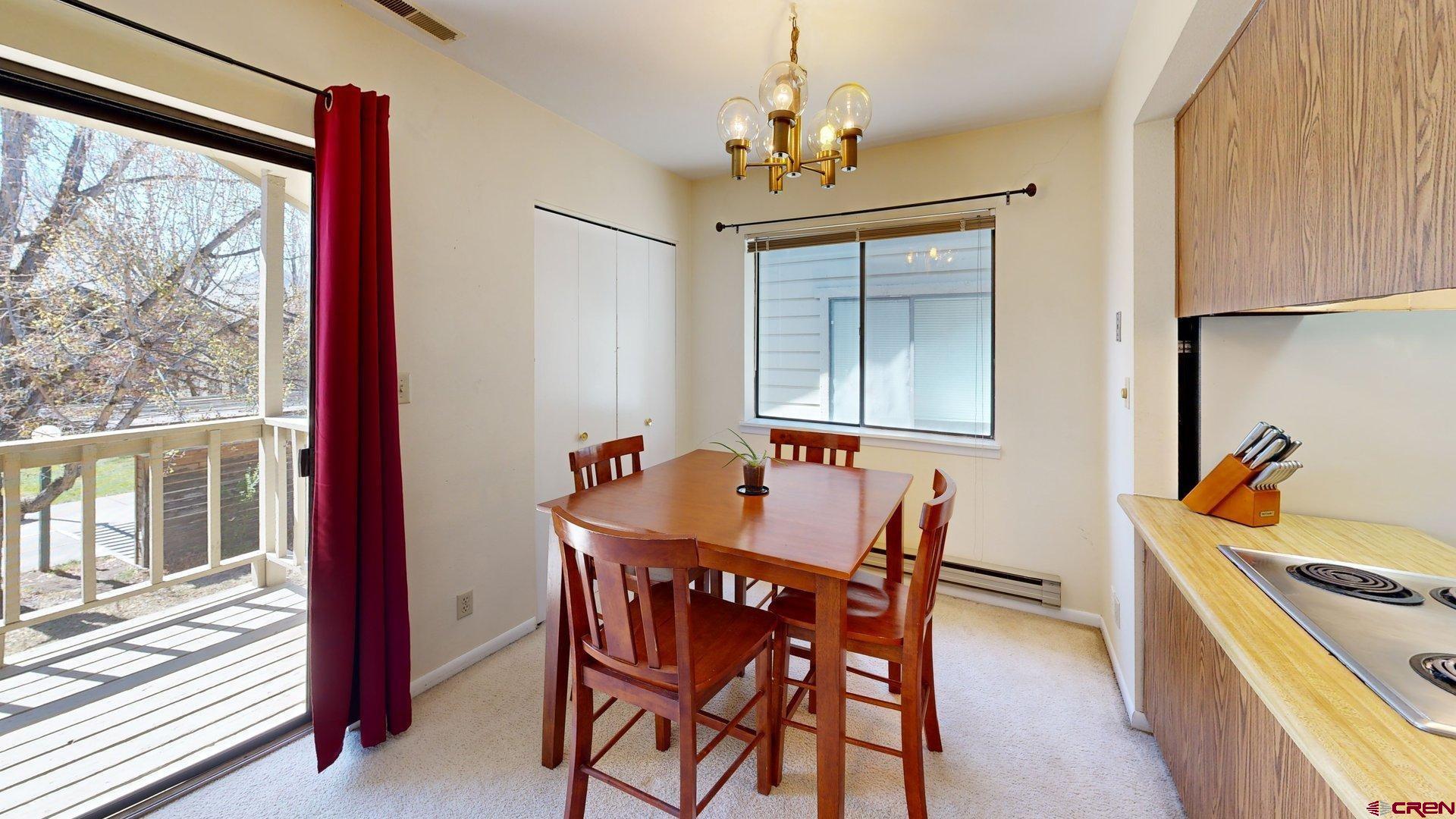 1200 Florida Road, Unit 52 Durango, CO 81301 - Photo 7 of 29 a dining room with furniture and window