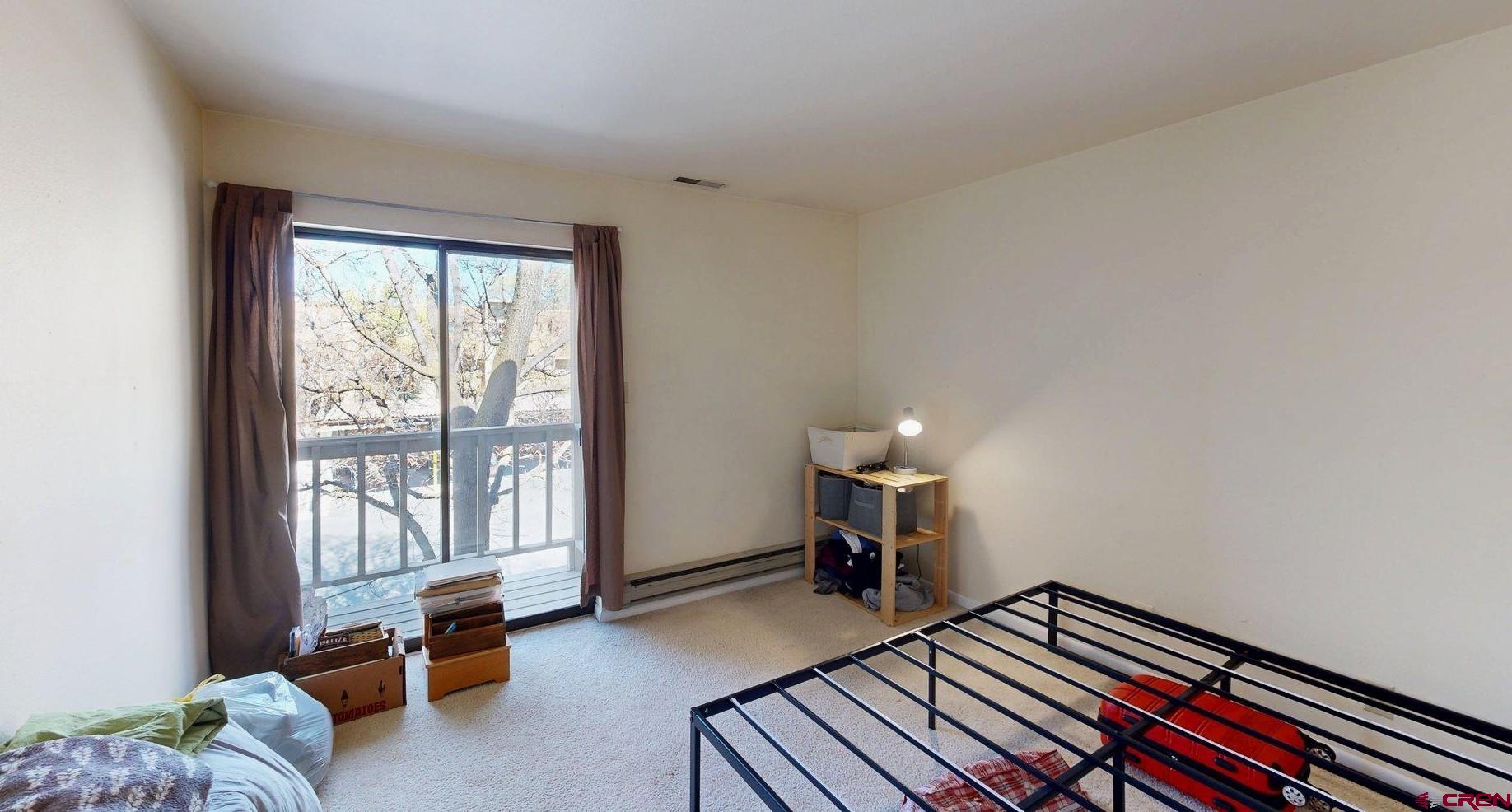 1200 Florida Road, Unit 52 Durango, CO 81301 - Photo 10 of 29 a bedroom with furniture and a window