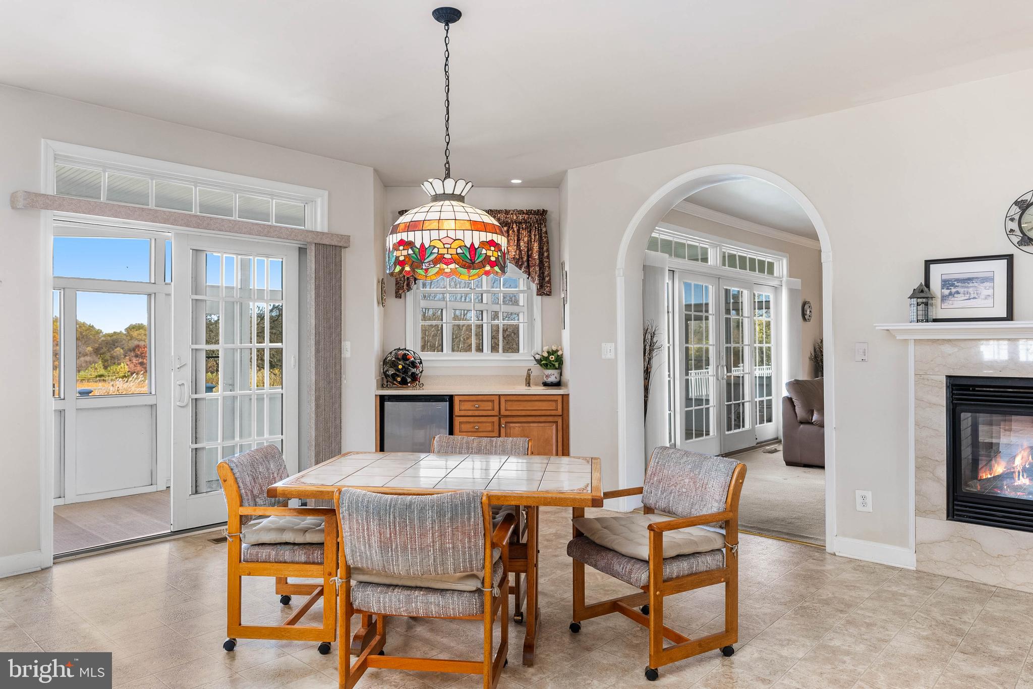 15507 Manor Road Monkton, MD 21111 - Photo 11 of 31 a dining room with furniture fireplace and wooden floor