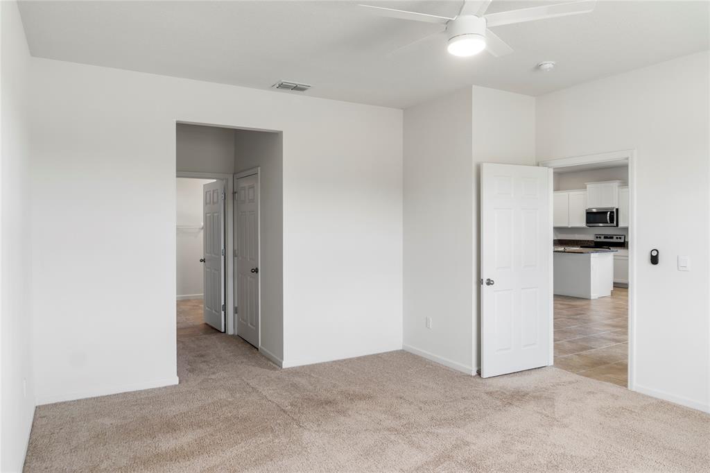 2025 Amazon Way Vero Beach, FL 32962 - Photo 12 of 33 a view of a kitchen with an empty space and a refrigerator