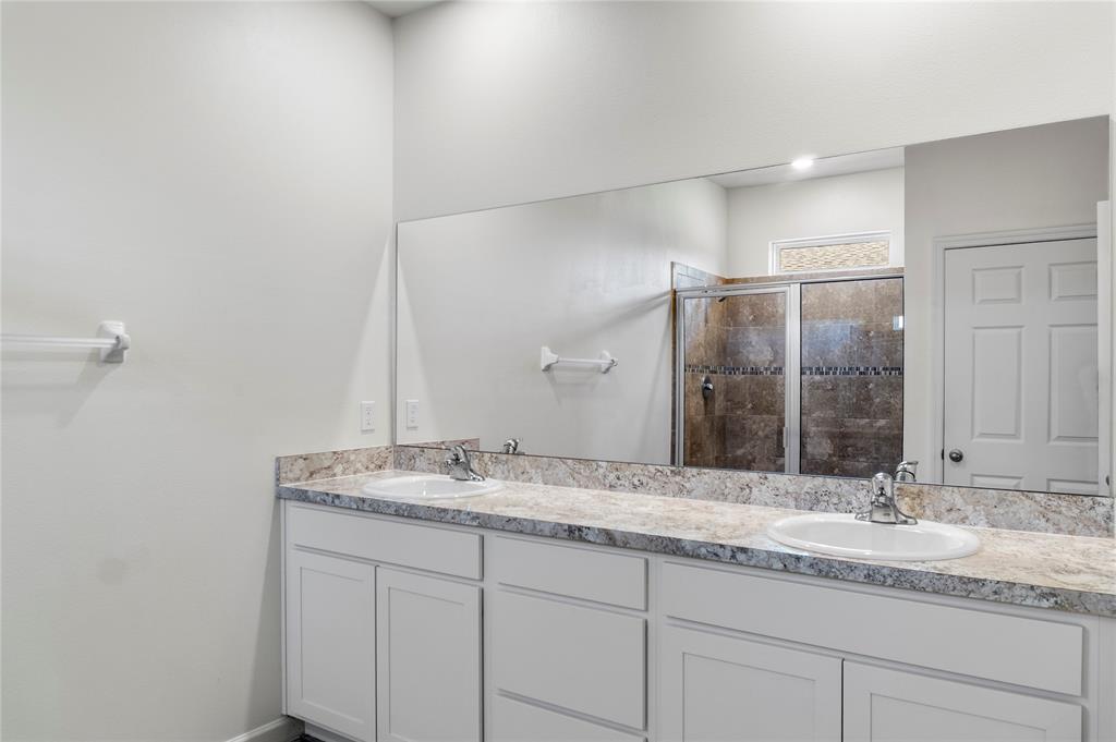 2025 Amazon Way Vero Beach, FL 32962 - Photo 14 of 33 a bathroom with a granite countertop sink and a mirror