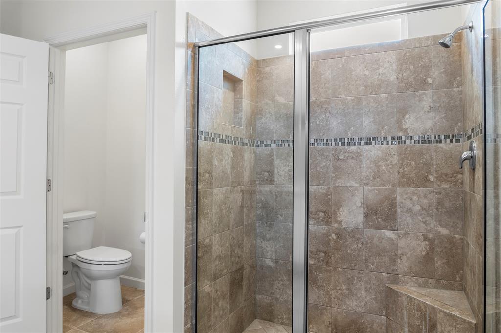 2025 Amazon Way Vero Beach, FL 32962 - Photo 15 of 33 a bathroom with a shower and a toilet