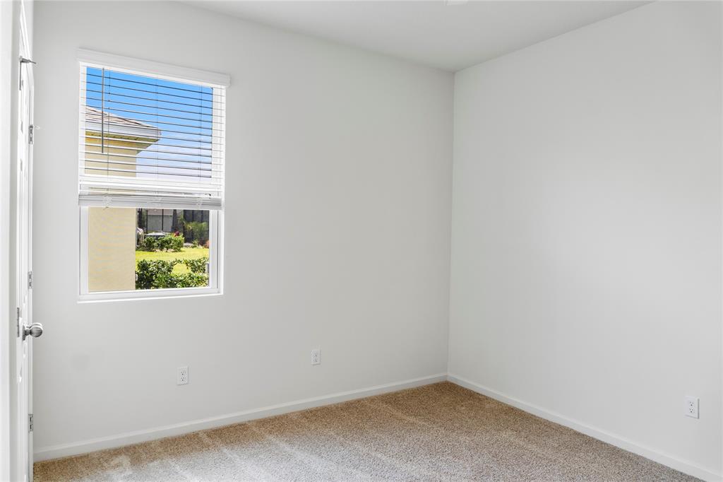 2025 Amazon Way Vero Beach, FL 32962 - Photo 20 of 33 an empty room with windows