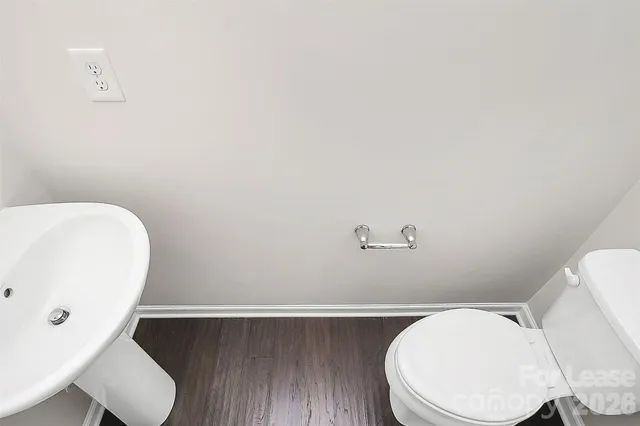 a bathroom with a toilet and a sink