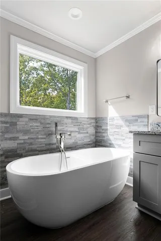 a white bath tub sitting in a bathroom