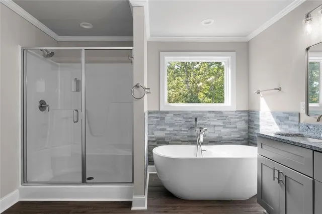 a bathroom with a bathtub and shower