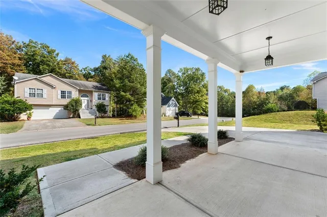 a view of a house with swimming pool and a yard