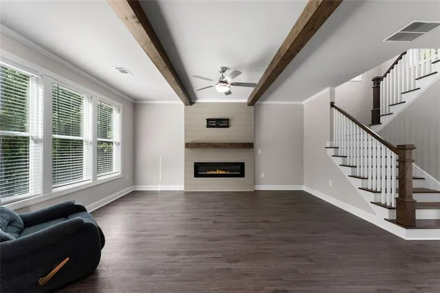 a view of livingroom with furniture wooden floor and windows