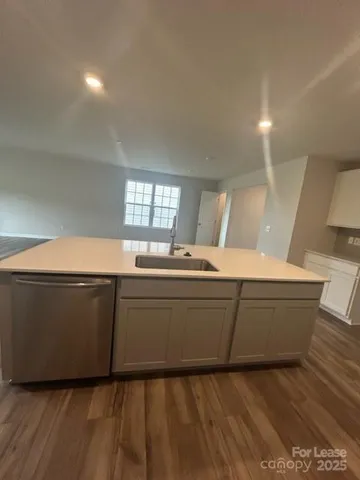 a living room with granite countertop furniture and a fireplace