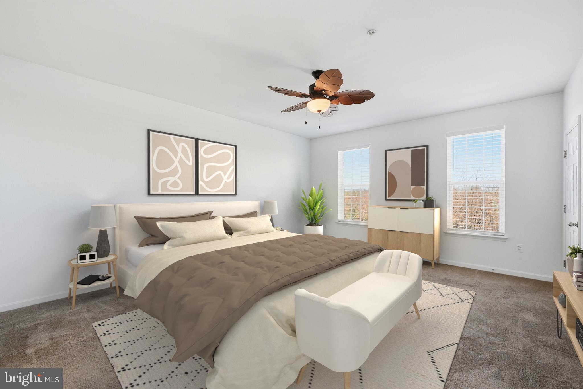 9539 Center Street Manassas, VA 20110 - Photo 23 of 41 a bedroom with a large bed and a chandelier