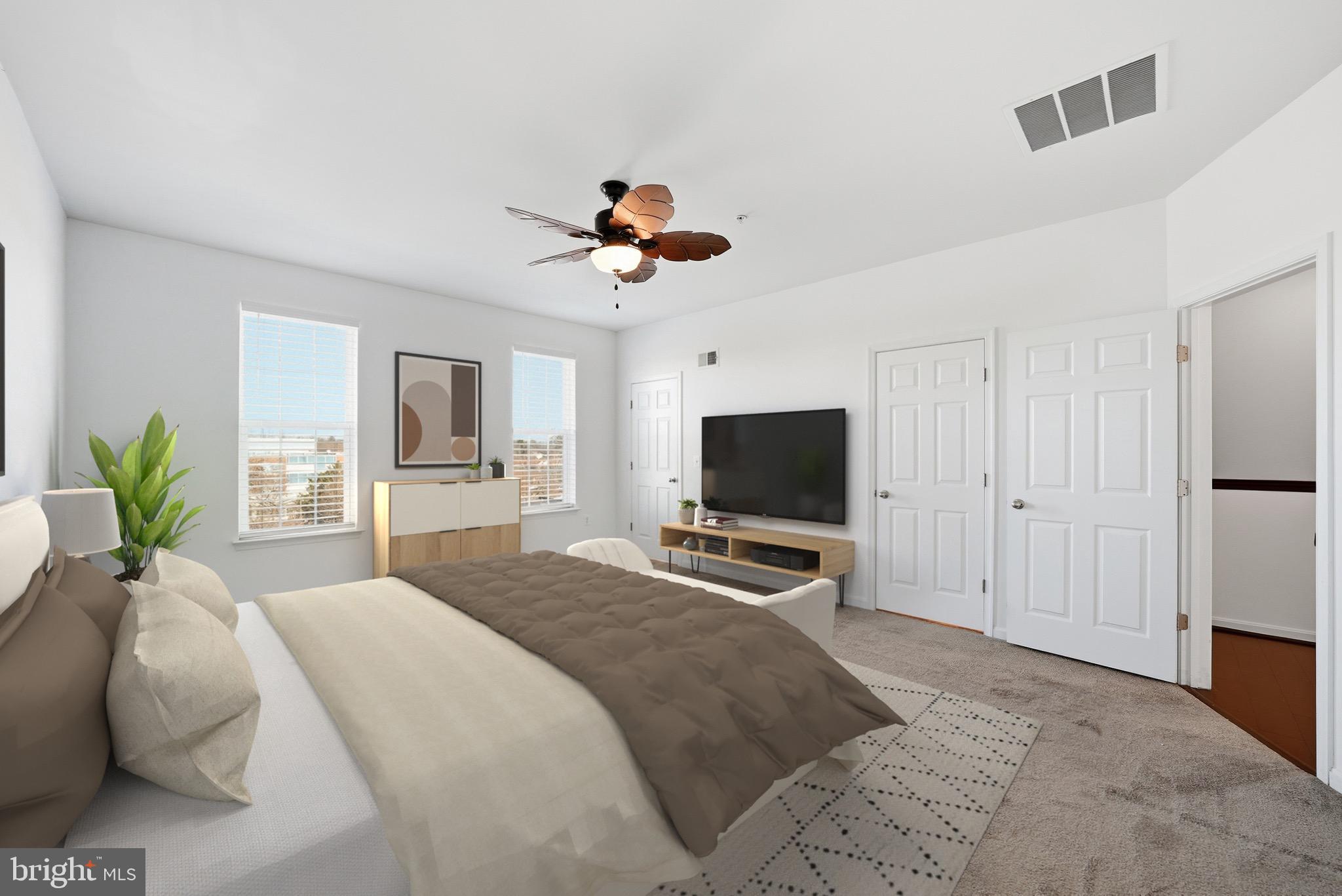 9539 Center Street Manassas, VA 20110 - Photo 24 of 41 a bedroom with a bed and a flat screen tv