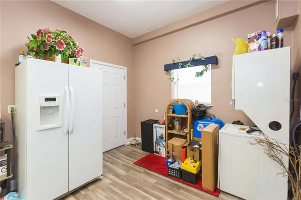 a room with refrigerator and toys