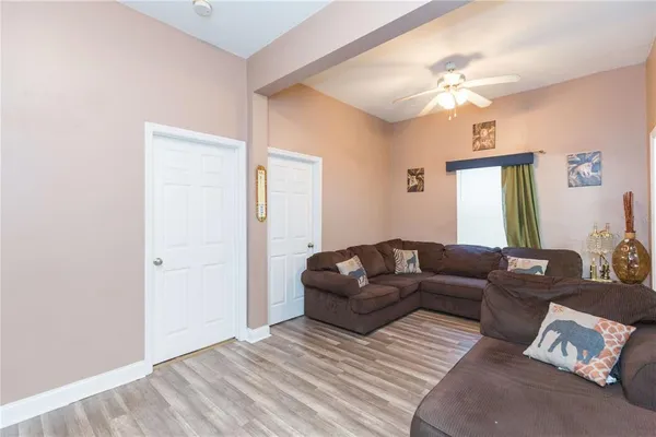 a living room with furniture and a window