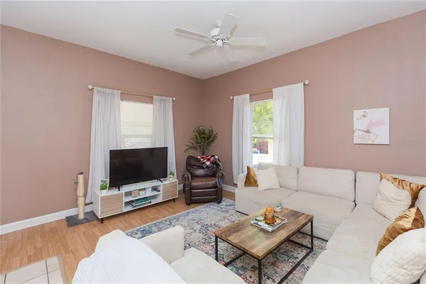 a living room with furniture and a flat screen tv