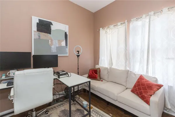 a living room with furniture and a window