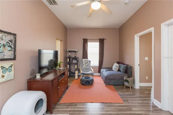 a living room with furniture and a flat screen tv
