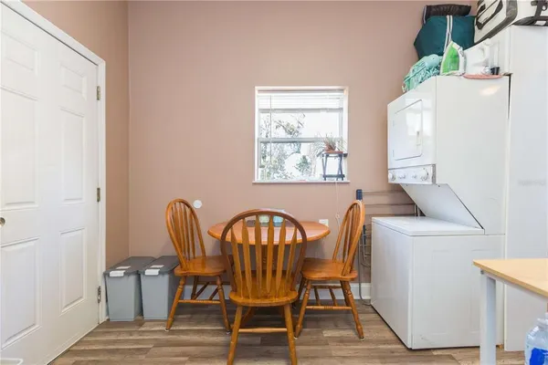 a view of a dining room with furniture and wooden floor