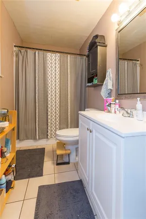 a bathroom with a sink a vanity and a mirror