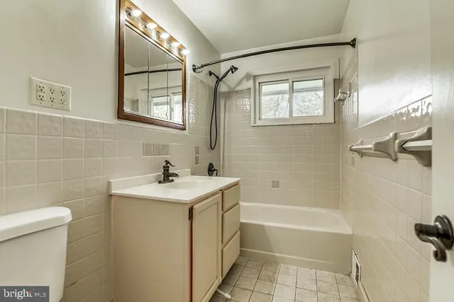 a bathroom with a sink a toilet and a bathtub