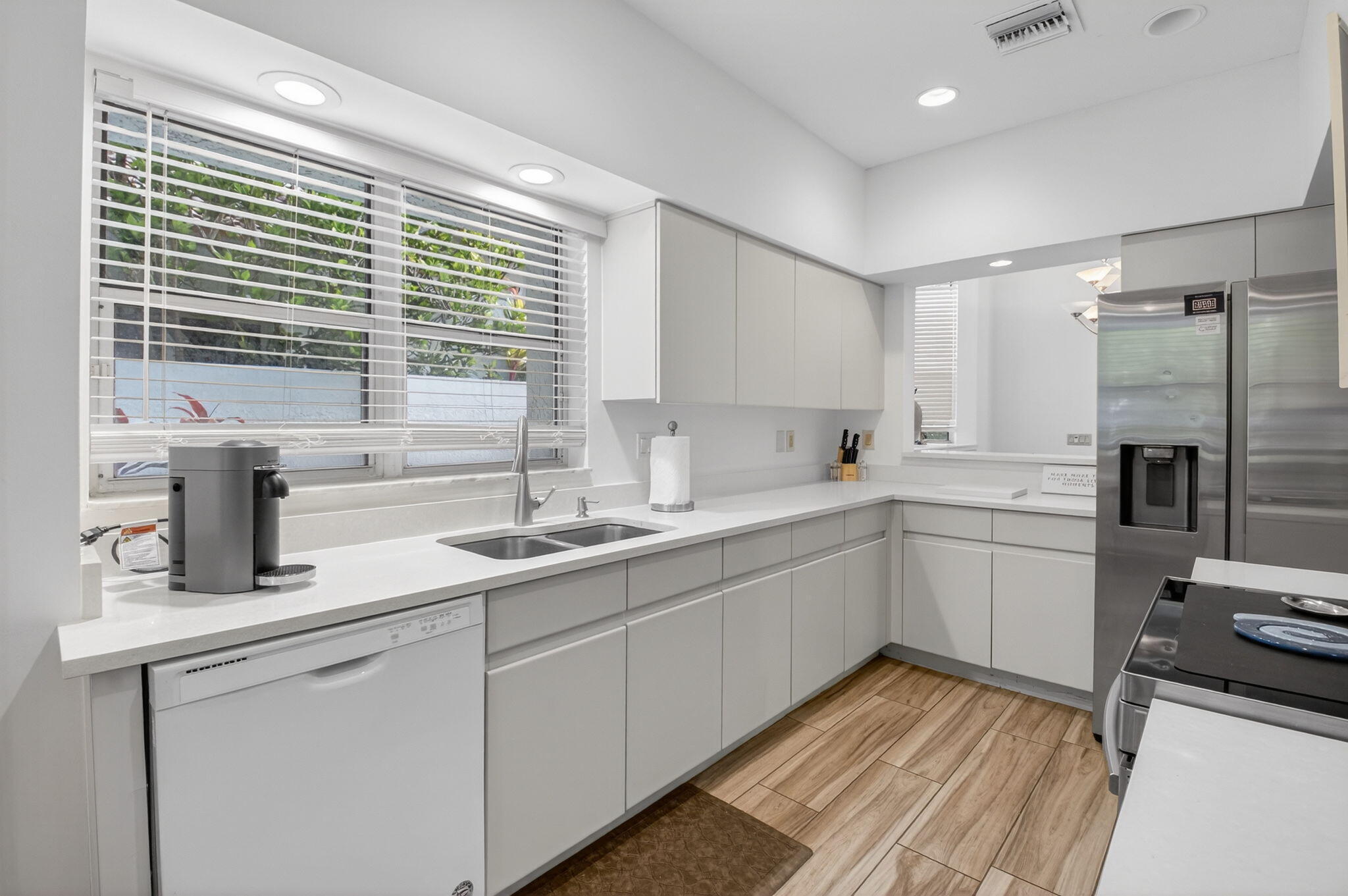 2225 Northwest 53rd Street Boca Raton, FL 33496 - Photo 12 of 46 a kitchen with sink cabinets and appliances