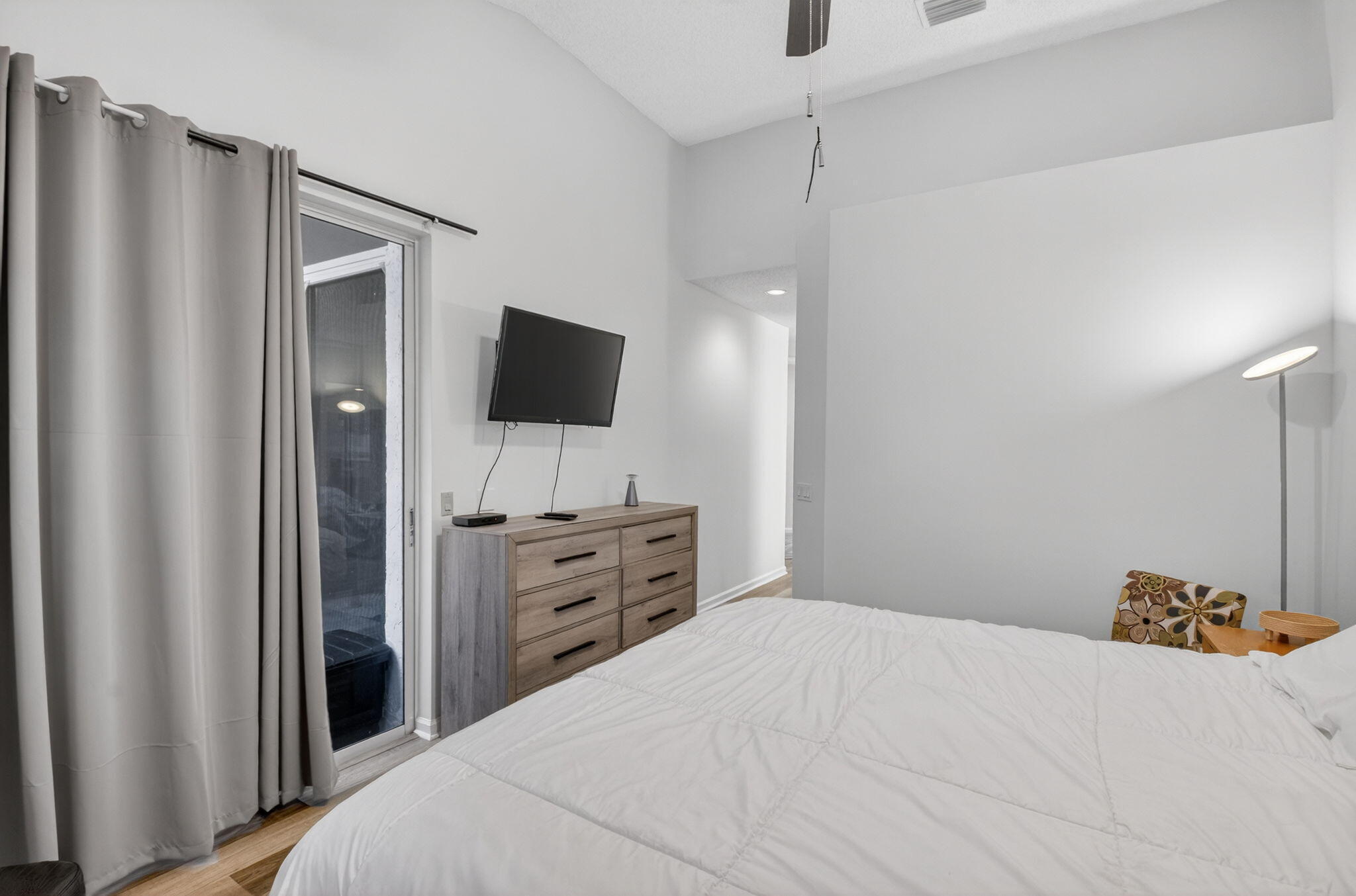 2225 Northwest 53rd Street Boca Raton, FL 33496 - Photo 18 of 46 a bedroom with a bed and a flat screen tv