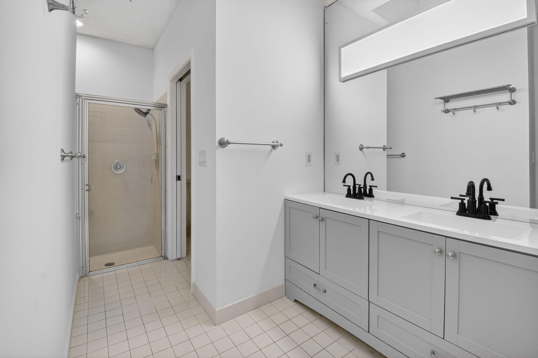 2225 Northwest 53rd Street Boca Raton, FL 33496 - Photo 20 of 46 a bathroom with a sink and a mirror