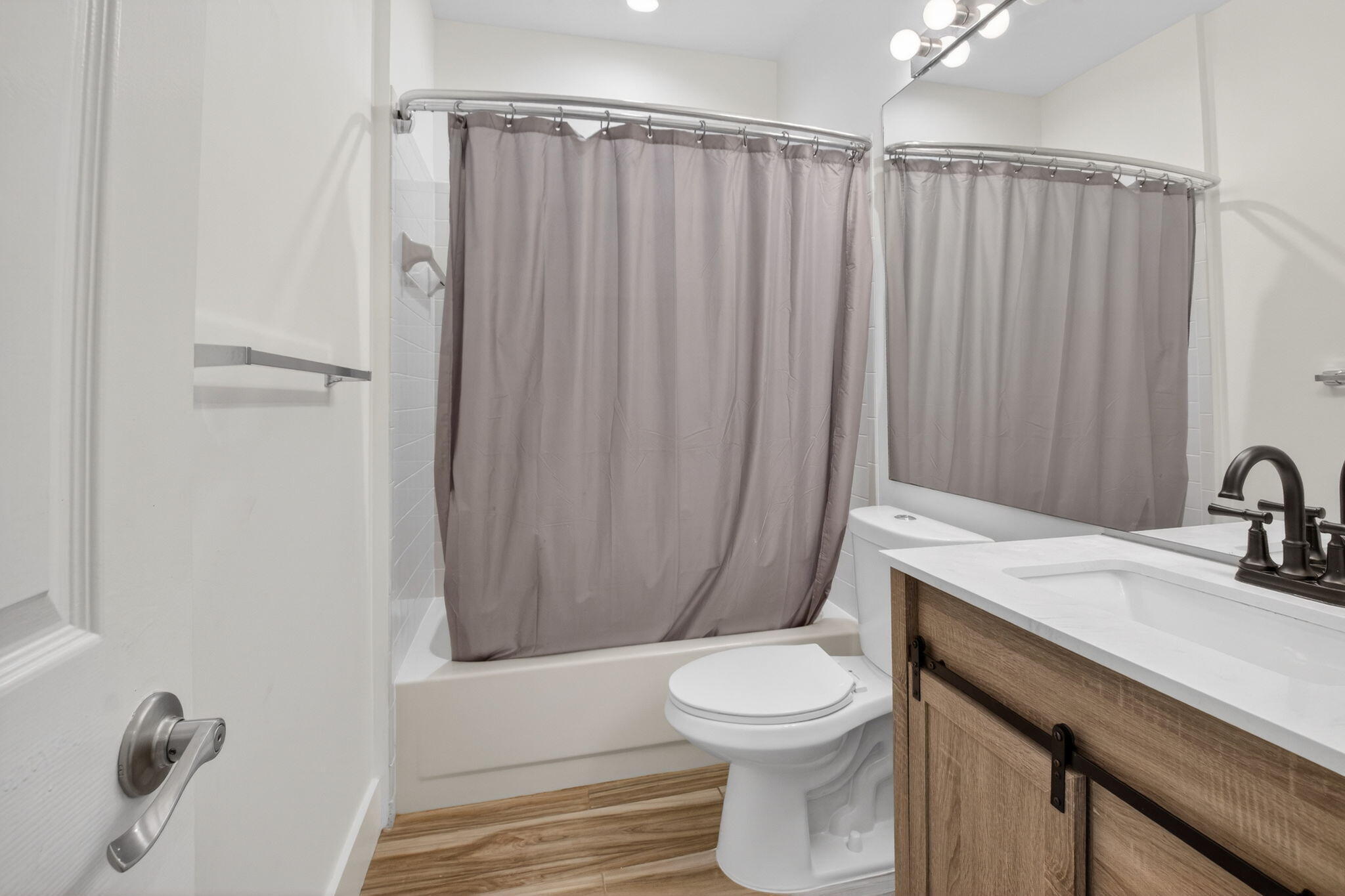 2225 Northwest 53rd Street Boca Raton, FL 33496 - Photo 21 of 46 a bathroom with a sink a toilet and shower