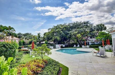 a view of a garden with sitting area