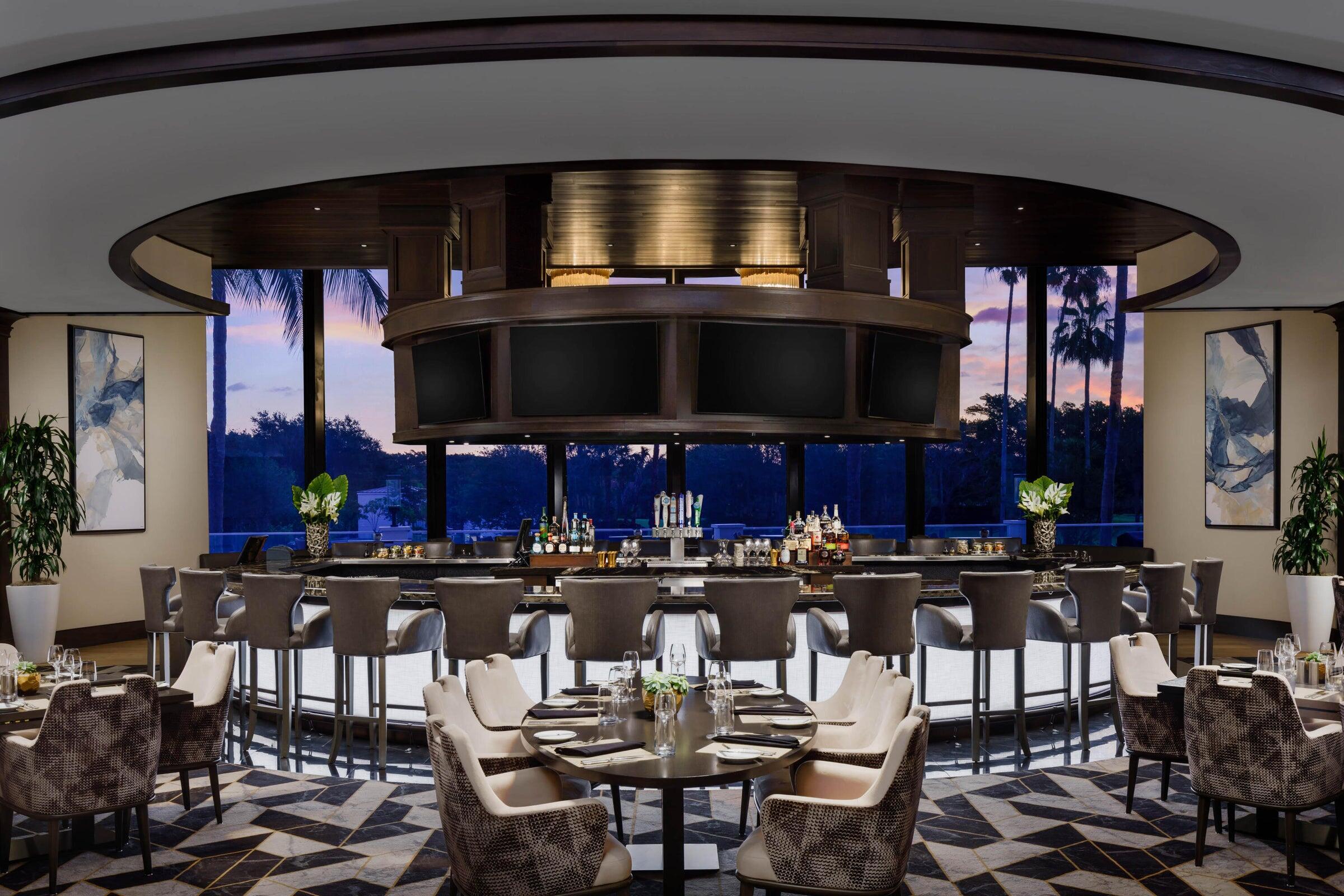 2225 Northwest 53rd Street Boca Raton, FL 33496 - Photo 40 of 46 a kitchen with a table and chairs in it