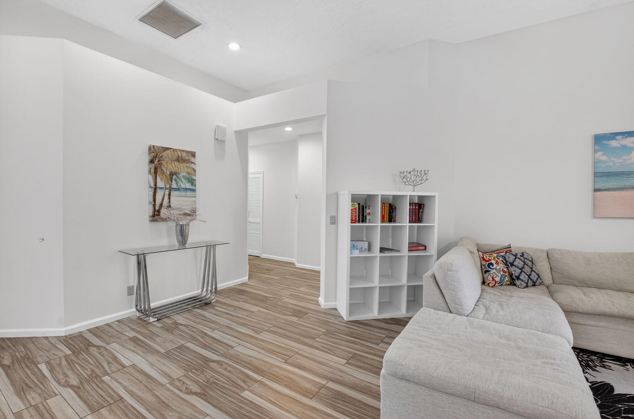 2225 Northwest 53rd Street Boca Raton, FL 33496 - Photo 6 of 46 a living room with furniture and a wooden floor
