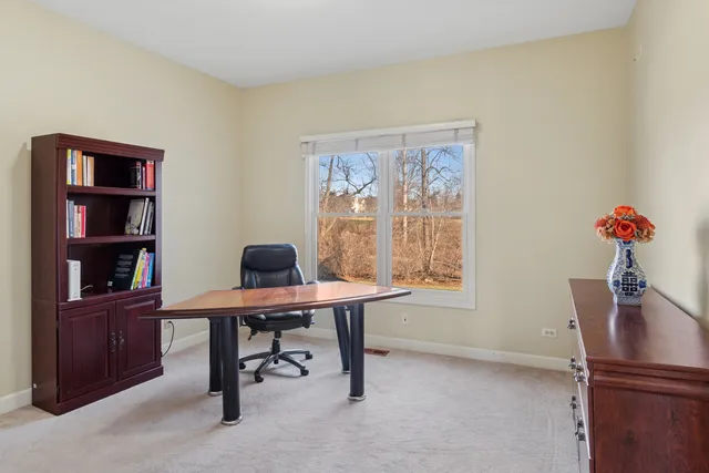 a view of a workspace with furniture