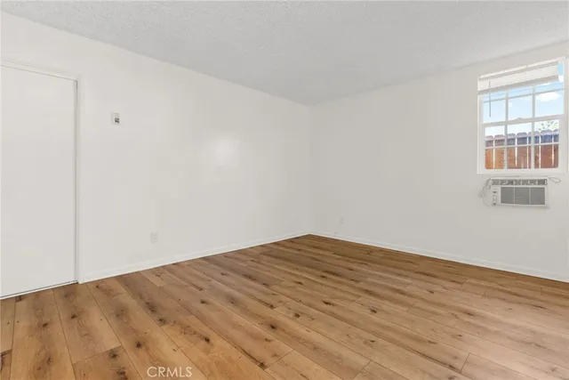 a view of a big room with wooden floor