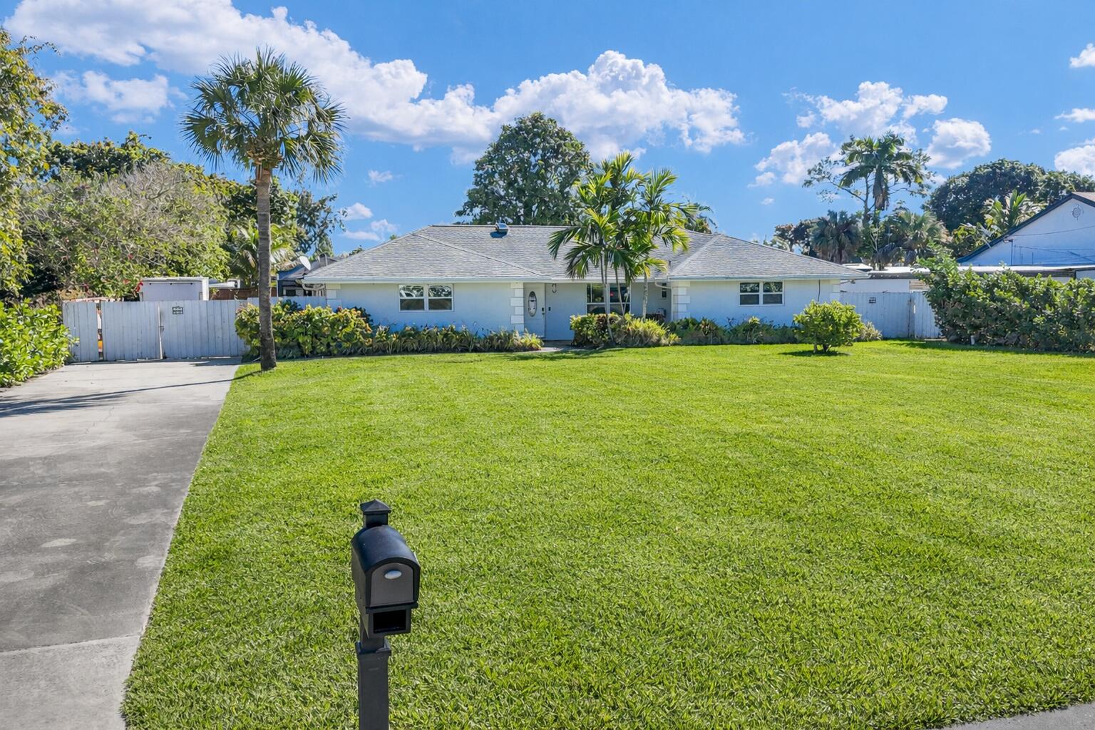 3150 Gulfstream Road Palm Springs, FL 33461 - Photo 1 of 51 Sunny suburban home with palm tree
