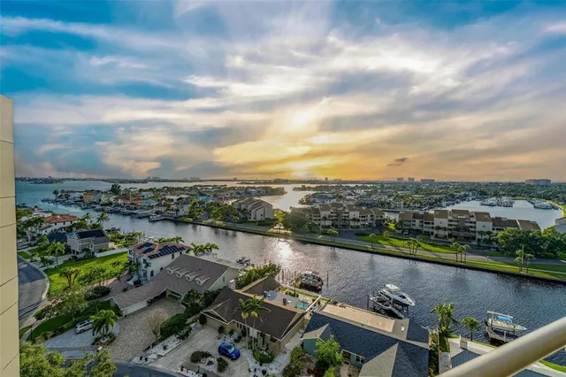 an aerial view of a city with lake view