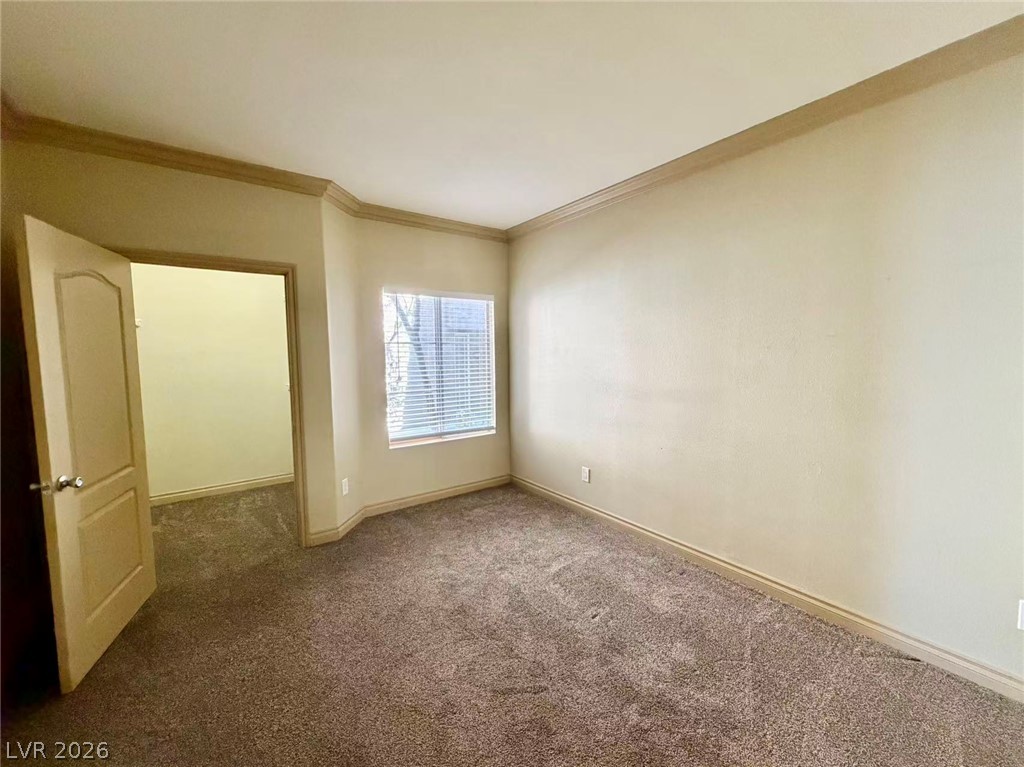 5525 West Flamingo Road, Unit 1019 Las Vegas, NV 89103 - Photo 10 of 18 A well-lit bedroom offering a warm and inviting atmosphere, perfect for comfortable living.