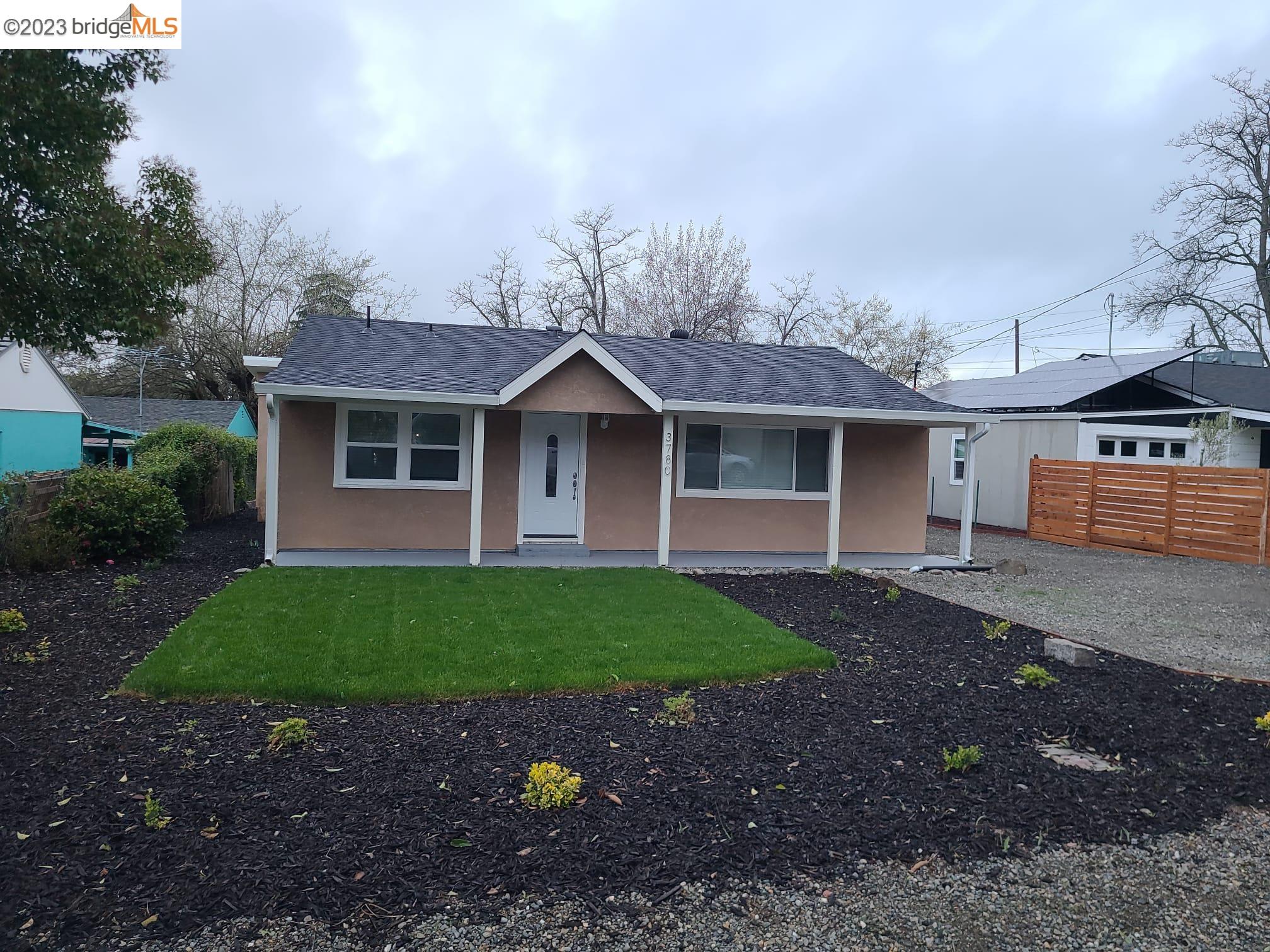 Downtown Loomis Loomis, CA 95650 - Photo 1 of 1 a front view of a house with a garden and yard