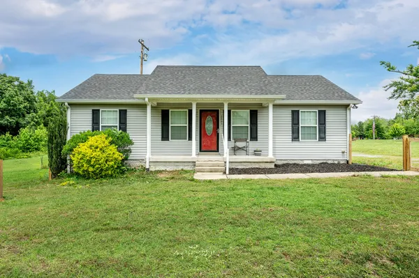 front view of a house with a yard
