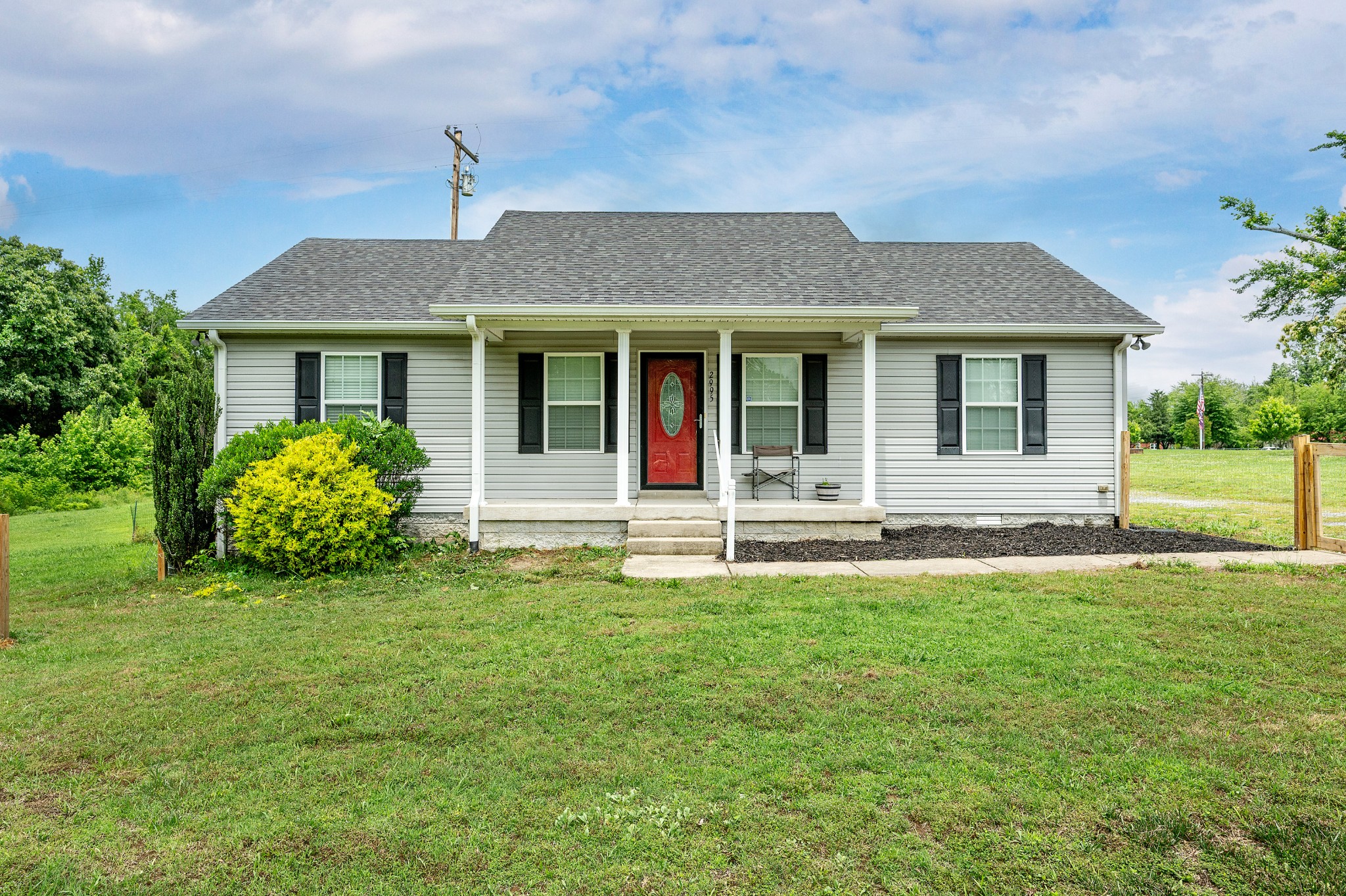 front view of a house with a yard