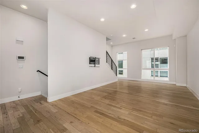 an entryway of a room with wooden floor