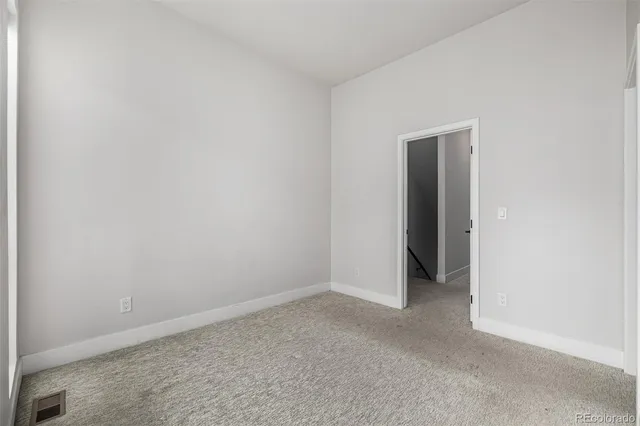 a bathroom with a double vanity sink toilet and shower