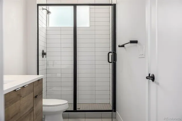 a bathroom with a sink vanity and mirror