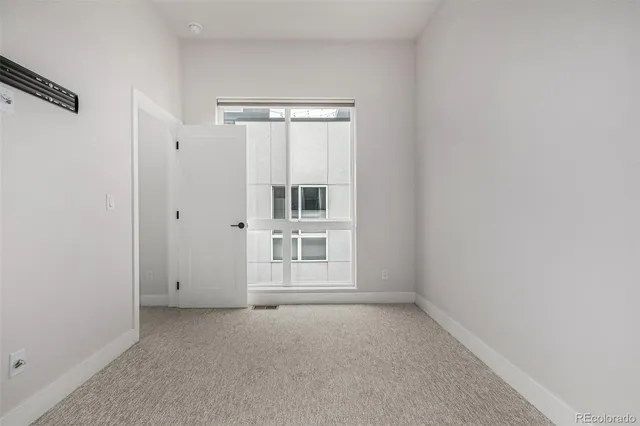 a view of a hallway with washer and dryer