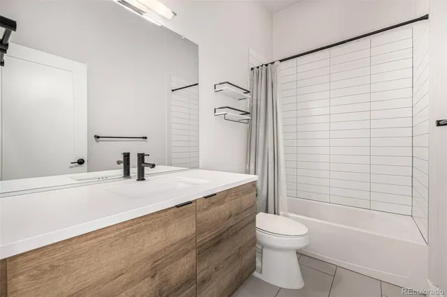 a room with wooden floor and furniture