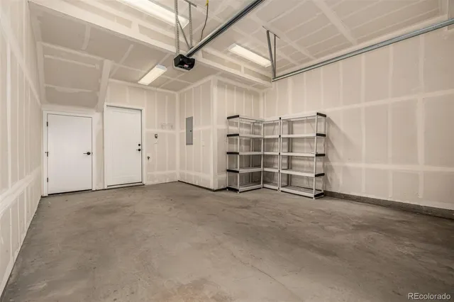 a living room with furniture a rug and a chandelier