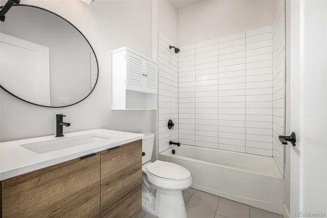 a kitchen with a sink a counter space appliances and cabinets