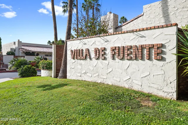 a green field with tree in the background