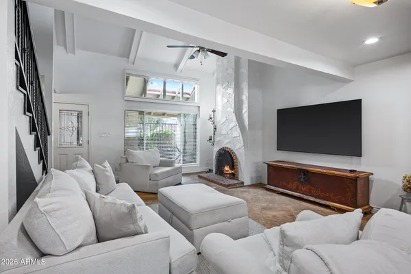 a living room with furniture and a flat screen tv
